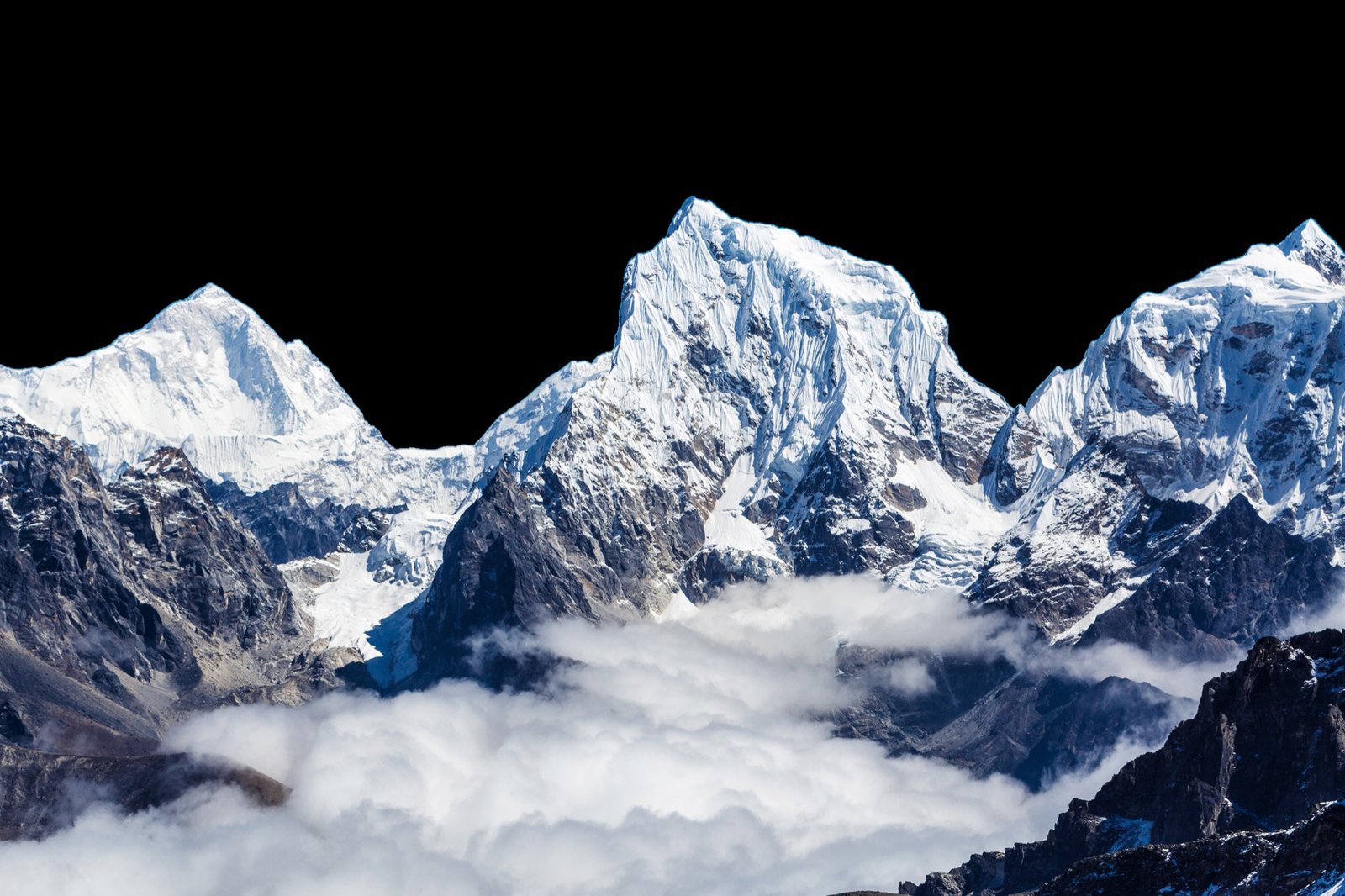 Snow peaks rising above the clouds